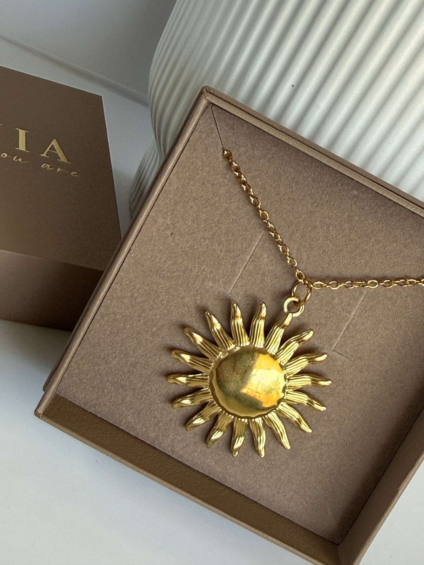 Aura Sun Charm
